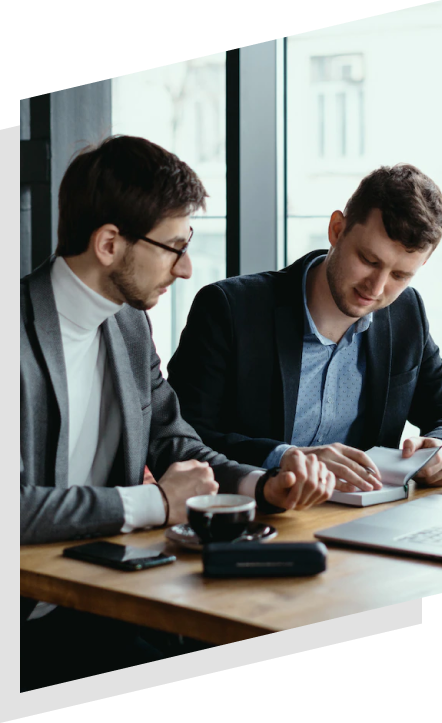 Two men reviewing documents at a table